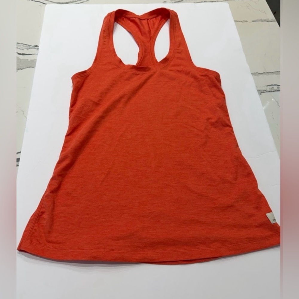 Vuori racer back tank top in color orange. Womens size large